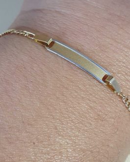 Esclava de bebe con chapa bordeada de oro blanco